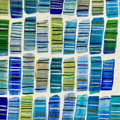 an abstract painting with blue and green stripes on white paper, in the shape of rectangles