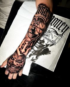 a man's arm with a tattoo on it that has an image of a clown