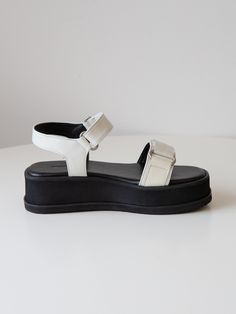 Editor's NotesPractical and stylish shoes that you'll never want to take off- Chunky platform sandals- Wave patterned upper strap- Velcro fastening- Handcrafted outsoleMeasurements (in.)- Size: KR 225MM ( IT 35.5 ) - KR 255MM (IT 38.5 )-- Heel 2.0 in. (Front 1.4 in. , Back 2.0 in.)- Fits true to the sizeComposition & Care- Upper: cow leather- Lining: Synthetic leather- Outsole: Rubber / EVA- Insole:  cow leather- Do not expose to moisture or direct sunlight for longDesigner- by TWV Platform Slip-on Sandals With Open Toe, Medium Width Platform Slip-on Sandals, Slip-on Platform Sandals In Synthetic Material, Spring Synthetic Platform T-strap Sandals, Platform Sandals With Cross Strap, Synthetic, Chunky Platform Sandals, Chunky Platform, Wave Pattern, Stylish Shoes