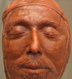 a close up of a clay face on display