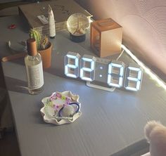 an alarm clock sitting on top of a table