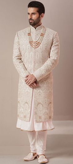 White Straight Kurta For Reception, White Straight Kurta Sherwani With Embroidery, White Embroidered Straight Kurta Sherwani, White Embroidered Straight Sherwani, Ceremonial Cream Kurta With Intricate Embroidery, Off White Sherwani With Chikankari Embroidery For Reception, Traditional Kurta With Chikankari Embroidery For Reception, Ceremonial Semi-stitched Sherwani With Intricate Embroidery, White Kurta With Cutdana For Reception