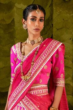 Hot pink lehenga embellished with silk tape, aari gold zari embroidery in paisley pattern, comes with separate cancan. Paired with an embroidered blouse and embroidered dupatta. - Aza Fashions Traditional Meenakari Lehenga For Wedding, Navratri Lehenga With Tilla Embroidery, Traditional Pre-draped Saree With Tilla Detailing, Semi-stitched, Tilla Lehenga For Navratri, Traditional Meenakari Choli For Reception, Traditional Semi-stitched Pre-draped Saree With Tilla, Traditional Wear With Meenakari For Reception, Traditional Kundan Lehenga With Tilla Details, Traditional Tilla Blouse Piece For Diwali