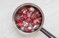 strawberries in a bowl with sugar on top