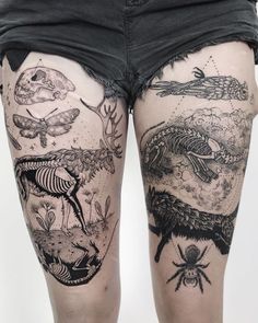 a woman's legs with tattoos on them and some animals in the water behind her