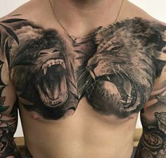 a man's chest with two lions on it