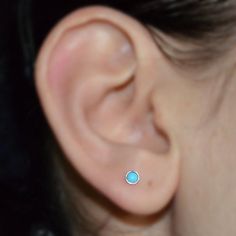 "This is a very beautiful Sterling Silver turquoise nose stud earring. This is simple and classic piece of jewelry for everyday wear. The listing is for ONE stud (not for a pair). The post wire end was rounded and polished to provide you with a smooth end for insertion. The nose stud was then polished. You can find answers to most of your questions (like \"earrings size & gauge guide\") in my blog at http://modernjb.wordpress.com/ This item does not contain nickel. --- C u s t o m i z i n g Turquoise Round Birthstone Earrings, Turquoise Birthstone Round Earrings, Hoop Conch Piercing, Silver Nose Piercing, Septum Earrings, Forward Helix Earrings, Tragus Jewelry, Tragus Stud, Nose Earrings