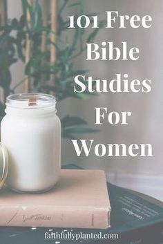 a glass jar sitting on top of a book next to a candle