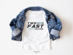 a white t - shirt with the words two fast and a blue jean jacket on it