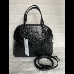 Brand New Beautiful Black Satchel Ck Logo Calvin Klein Vegan Embossed Handbag Shoulder Tote Purse A Very Special Bag With A Unique Look. Sure To Stand Out Among The Others. Great Size For Everyday Use. * Main Body Zipper * 1 Interior Zipper, * Multiple Slip Pockets * Removable Adjustable Shoulder Straps * 2 Leather Hand Straps With 6”Drop * Black Tone Hardware H 9.5” W 12” D. 5” Calvin Klein Tote Bag, Ck Logo, Calvin Klein Handbags, Calvin Klein Bag, Black Satchel, Brown Handbag, Black Leather Bags, Black Shoulder Bag, Black Purses