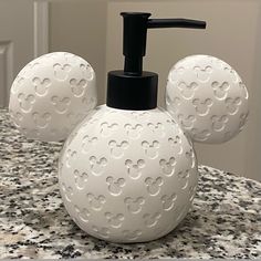 mickey mouse soap dispenser on top of a counter