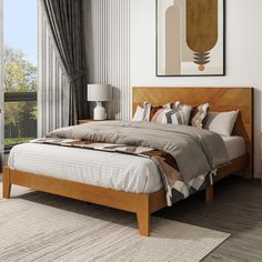 a bedroom with a bed, nightstands and large window overlooking the trees in the background