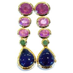 Bochic "Capri”, Ruby, Blue Sapphire & Emerald Drop Earrings set in 22 Gold & Silver Multi natural gem earrings Beautiful Natural Blue Sapphire from Sri Lanka - 17 carats Cabochon pear shape drops Pink Ruby Color - 10 carats Oval brilliant shapes Natural Green emeralds from Zambia - 1 carat Round brilliant shapes This Earrings are perfect to wear - Day to night, swim wear to evening wear. Crafted in 22 karat gold and silver with purity marks. You will steal the show with this Drop earrings and yo Ruby Cabochon Earrings, Luxury Turquoise Gemstone Earrings, Luxury Ruby Earrings With Gemstone Accents, Luxury Blue Cabochon Earrings, Luxury Ruby Chandelier Earrings, Emerald Drop Earrings, Night Swim, Emerald Earrings Drop, Ruby Color