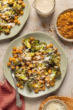 broccoli and chickpeas are served on two plates