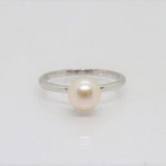 Vintage Sterling Silver White Pearl Solitaire Ring...Marked 925...Total of weights 1.2grams... Size 7...Measure of Pearl 3.5MM...It's in very good condition. Classic Hypoallergenic White Gold Rings, Hypoallergenic Classic White Gold Rings, Stackable White Gold Pearl Ring With Round Band, Stackable Pearl Ring In White Gold With Round Band, Classic White Stackable Rings In Sterling Silver, Stackable White Gold Pearl Ring, Classic Silver Stackable Pearl Ring, Classic Sterling Silver Hypoallergenic Ring, Classic Stackable Pearl Ring