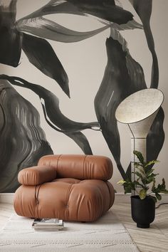 a living room with a large wall mural and leather furniture