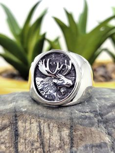 "Sterling silver, good weight, cast mens ring with a Moose Head on the Front. Made out of sterling silver by our Jewelry artisan. Material: Sterling Silver 925 Front width: 19mm Size see drop-down menu for availability Stamped \"925\" weight: 15 gr. Comes with jewelry box ready to ship *Resizing is not available for inlaid rings." Silver Sterling Silver Signet Ring, Artisan Sterling Silver Ring With Polished Finish, Unique Gift Signet Ring, Collectible Nickel Free Sterling Silver Signet Ring, Unique Polished Sterling Silver Signet Ring, Artisan Sterling Silver Signet Ring, Artisan Sterling Silver Signet Ring With Polished Finish, Brutalist Sterling Silver Rings As Gift, Moose Head