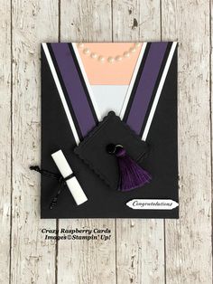 a graduation card with a purple tassel and pearl necklace on it's neck