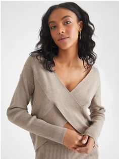 The Harlow rib sweater is crafted from fine rib fabric for a luxurious feel and a sleek, streamlined silhouette. The wrap front design is both fashionable and reversible, so you can switch up your look to suit any occasion. Add effortless sophistication and modern elegance to your wardrobe with this must-have style. Relaxed fit Length: 22" Turn garment inside out. Machine wash cold water with like colors. Gentle cycle. Tumble dry low. Do not bleach. Cool iron if needed. 80% Rayon, 20% NylonStyle Modern Cashmere Tops For Fall, Chic Long Sleeve Cashmere Cropped Sweater, Modern Winter Tops For Loungewear, Modern Tops For Winter Loungewear, Modern Winter Loungewear Tops, Chic Ribbed Cashmere Tops, Trendy Long Sleeve Cashmere Top, Fitted Long Sleeve Cashmere Cropped Sweater, Long Sleeve Ribbed Cashmere Top