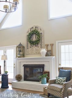 a living room filled with furniture and a fire place in the middle of a room