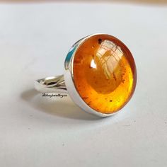 Welcome to our shop, Benefits of Amber Ring , Amber stone is considered a great natural purifier for its ability to absorb negative energy and vibrations from the body. It is also used for stimulating regeneration and healing of the soft tissue, detoxification, heart problems, arthritis, headache, and pain. Thanks for visiting my shop, Ring Bernstein, Carnelian Ring, Heart Problems, Silver Spinner Rings, Amber Ring, Amber Stone, Wide Band Rings, 925 Silver Ring, Amber Jewelry