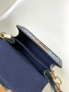 This Dauphine small handbag is made of classic logo denim to show the relentless pursuit of sustainable denim craftsmanship, and convey the atmosphere of neo-retro together with the cow leather trim. An optional chain and interior compartment add functional details.

Dimensions: 20 x 15 x 9 cm (length x height x width) Rectangular Monogram Canvas Flap Bag For Everyday Use, High-end Blue Box Bag For Everyday Use, High-end Blue Box Bag For Daily Use, Everyday Rectangular Monogram Canvas Flap Bag, High-end Blue Satchel For Everyday Use, High-end Blue Satchel For Everyday, Designer Blue Flap Bag With Removable Pouch, Designer Blue Box Bag For Office, Blue Designer Box Bag For Office