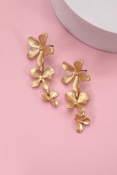 Beautiful earrings that make a statement! Perfect for your next vacation! Matte finish lightweight 2" long Gold Earrings For Beach Spring Season, Summer Flower Shaped Metal Earrings, Elegant Earrings For Vacation In Spring, Spring Vacation Dangle Jewelry, Gold Flower-shaped Earrings For Beach, Flower Shaped Earrings For Spring Vacation, Flower-shaped Earrings For Spring Vacation, Flower-shaped Earrings For Vacation In Spring, Trendy Flower Shaped Jewelry For Vacation