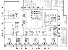 the floor plan for an office with tables, chairs and desks in it's center