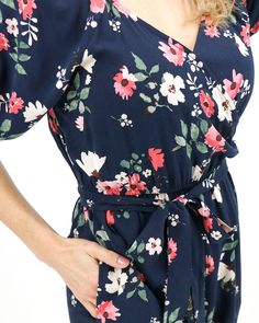 Hello Spring Floral Jumpsuit | Floral Jumpsuit Jump right into spring with the new Hello Spring Floral Jumpsuit! This short sleeved, deep navy jumpsuit features a flattering surplice crossover bodice, with custom designed all over floral print and everyone's must-have design essential - pockets! Whether dressing up for special springtime occasions, or adding an elevated touch to your everyday look, your style is sure to bloom in this jumpsuit! Why you’ll love it: Straight leg navy floral jumpsui Blue Floral Jumpsuit, Navy Jumpsuit, Jumpsuit With Pockets, Floral Print Jumpsuit, Grace And Lace, Design Essentials, Floral Jumpsuit, Printed Jumpsuit, Hello Spring