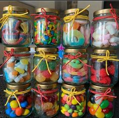 there are many jars with candy in them