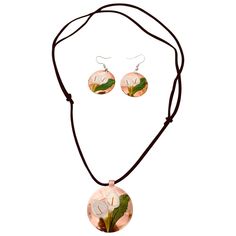 Replace the boring designs with this trendy hand-painted copper necklace earring set! The necklace set is crafted with the most refined copper metal that increases the life span. The necklace pendant and earring feature a creative sketch of white flowers and leaves on a sandal-enameled plate to offer a unique and glamorous look. The black adjustable rope chain of the necklace is very skin-friendly, and you can wear it on your neck for long hours without any irritation. You can wear this necklace Adjustable Copper Flower Jewelry, Flower Leaf, Long Hours, Copper Necklace, Creative Sketches, Copper Metal, Flowers And Leaves, Rope Chain, Necklace Earring Set