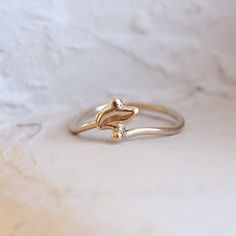 Gilded Foliole is a delicate art deco inspired leaf ring. The polished gold shimmers so beautifully. The perfect promise ring? I fabricated this design from 14k yellow gold in my studio. Size 6 or 52 or 16.5 or L 1/2 (can be sized) nangijalajewelry.etsy.com Gold Sterling Silver Rings In Art Deco Style, Elegant Promise Rings In Recycled Gold, Elegant Rings In Recycled Gold, Stamped 14k, Delicate Marquise Yellow Gold Ring, Autumn Gifts, Leaf Ring, Fall Gifts, Gold Shimmer, Delicate Rings