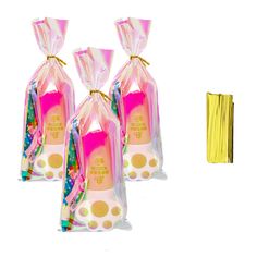 three bags filled with different types of toothbrushes next to some yellow straws