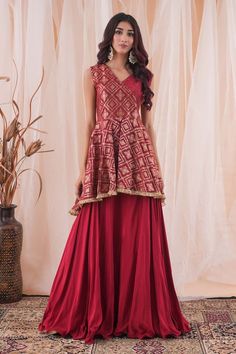 Maroonish red banarasi brocade peplum top with cutdana hand embroidery. Comes with a crepe lehenga. - Aza Fashions Festive Peplum Salwar Kameez With Zari Work, Traditional Peplum Lehenga For Reception, Diwali Reception Peplum Palazzo Set, Traditional Sleeveless Palazzo Set For Navratri, Sleeveless Festive Palazzo Set For Diwali, Transitional Sleeveless Anarkali Sets, Sleeveless Self Design Anarkali Set For Diwali, Traditional Sleeveless Salwar Kameez For Reception, Traditional Sleeveless Palazzo Set For Diwali