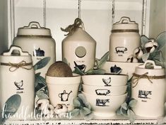 white ceramic kitchen canisters with farm animals on them