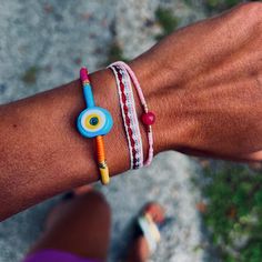 A small blue evil eye glass bead on a multicolor thread bracelet- Each item is handmade and unique, may have slight variations- This item is adjustable- Circumference of Bracelet: 6.25-9"- Width of Bead: 16 mm - Please allow 3-5 days for items to ship Pink Beaded Bracelets, Handmade Evil Eye, Shell Collection, Thread Bracelets, Kids Bracelets, Kids Necklace, Pearl Collection, Blue Evil Eye, Evil Eye Bracelet