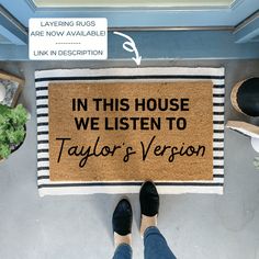 a door mat that says in this house we listen to taylor's version on it