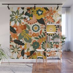 an orange and green floral wall mural in a living room