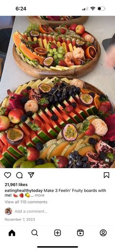 two trays filled with different types of fruit on top of a white countertop