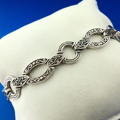 * Designer 18K White Gold Sterling Silver Scroll Oval Circle Link Toggle Bracelet * Length: 8-1/4" * Width: 1/2" * Clasp: Toggle * Weight: 22.3 g * Marked: 925 * 18K * Condition: Great, as pictured. * S1683    Exported By ExportYourStore :) Luxury Engraved Oval Link Jewelry, Toggle Bracelet, Sterling Silber, Jewelry Bracelets, Etsy Accessories, Accessory Gift, Beaded Bracelets, Gift Card, White Gold