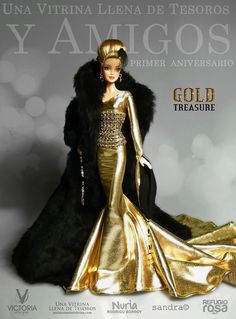 a barbie doll is wearing a gold gown and black fur stole with an elaborate headpiece