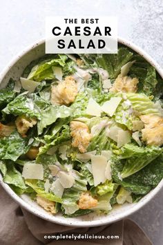 the best caesar salad in a white bowl on top of a table with text overlay