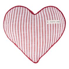 a red and white striped heart shaped pillow with i love you written on the front