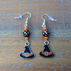 "Halloween Earrings, Enamel Witch's Hat Earrings, Witch's Hat Earrings, Witch's Hat Charms, Sterling Silver Earrings, Orange and Black Halloween Earrings!!  These Enamel Witch's Hat Charm Earrings are a must for you to wear this year. The Witch's Hat Charm itself measures 11/16 \" wide at the brim and 3/4 \" in height. The total length of the earrings measure 2 \" from the ear post to the tip of the earring. The earrings include:  Sterling Silver Ear Wires - Enamel Witch's Hat Charms - 8 mm Blac Adjustable Nickel-free Earrings For Halloween, Adjustable Witchy Earrings For Halloween, Themed Black Dangle Earrings, Handmade Themed Black Earrings, Witchy Halloween Earrings Adjustable, Witchy Adjustable Earrings For Halloween, Themed Black Dangle Jewelry, Adjustable Themed Earrings With Ear Wire, Themed Adjustable Earrings With Ear Wire