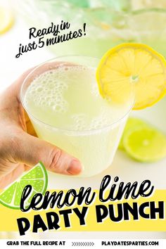 someone holding a lemon lime party punch in their hand