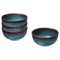 three bowls are stacked on top of each other in blue and brown tones, one is empty