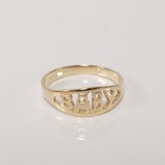 "Thanks for shopping our vintage estate store. We tend to sell well below wholesale and truly hope you enjoy all of our items. Many of the items are one of a kind, so please enjoy scrolling through the pictures and hopefully something will catch your eye. Spots are from camera or reflections. Estate 14k yellow gold baby ring. Spelled baby in block style. Ring size: 1.5 Setting: 1/4\" 5mm Band width: 1.7mm Weight: .87 gram Sweet ring, marked 14k." Personalized Engraved Yellow Gold Ring For Collectors, Classic Gold Engraved Ring With Custom Name, Personalized Antique 14k Gold Rings, Antique Personalized Engraved Gold Ring, Classic Yellow Gold Engraved Ring With Custom Name, Classic Gold Rings With Custom Name, Gold Engraved Round Ring For Birthday, Gold Engraved Rings For Birthdays, Vintage Personalized 14k Gold Engraved Ring