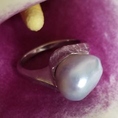 "* This beautiful pearl ring would be a wonderful gift to a bride on her wedding day, or perhaps the mother of the bride or groom! The silvery gray pearl is is unique and beautful, giving this ring tons of understated charm and elegance. This ring is very sturdy and well-made, and it shows! * This piece weighs 6.7 grams, and is stamped \"14K\" inside the shank. The pearls measure approximately 12.6 mm x 12.9 mm This ring is a US size 7. Please message us about sizing options prior to purchase! * Luxury Silver Pearl Ring For Wedding, Silver Akoya Pearl Ring For Anniversary, Silver Akoya Pearl Drop Ring, Modern Silver Pearl Ring For Gifting, Silver High Luster Pearl Ring For Anniversary, Modern Silver Pearl Ring As Gift, Silver Oval Pearl Ring With High Luster, White Gold Pearl Ring With High Luster For Wedding, Unique White Gold Pearl Ring For Formal Occasions