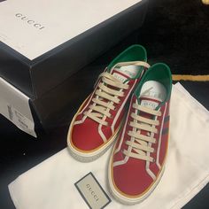 Gucci Mens Red Tennis 1977 Sneaker 606111 Condition Is Brand New With Box Dust Bags And Extra Laces. Come With Dust Bags And Auth Card 100% Authentic And Will Be Shipped Gucci Leather Sneakers With Logo, Red Leather Sneakers With Logo, Red High-top Sneakers With Embroidered Logo, Gucci Leather High-top Sneakers With Embroidered Logo, Casual Gucci Leather Sneakers, Gucci Designer High-top Sneakers With Embroidered Logo, Designer Gucci High-top Sneakers With Embroidered Logo, Red Casual Sneakers With Embroidered Logo, Casual Red Sneakers With Embroidered Logo