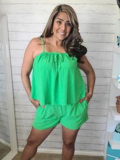 "Get ready to lounge in style with our Green Valley Tank and Shorts Set! Made from a woven material, this set features adjustable straps, an elastic band on the shorts, and convenient pockets. The light green grass color adds a touch of nature to your wardrobe. Comfortable and chic, this set is a must-have!"